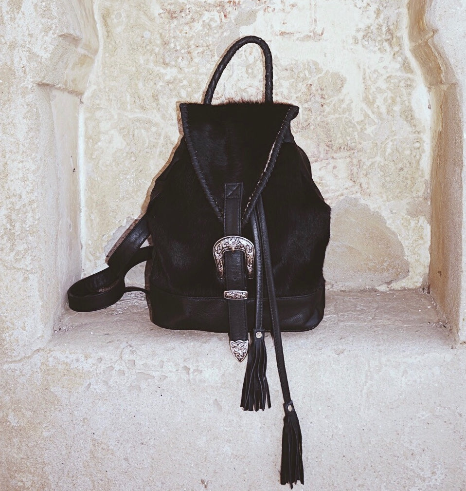Leather Cowhide Backpack – Western Buckle, Braided Handle, Canvas Interior